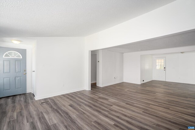 817 Brownings Cv, Shipman, VA 22971 - unfurnished living room featuring dark wood-type flooring, a textured ceiling, and baseboards