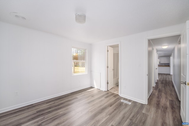 817 Brownings Cv, Shipman, VA 22971 - unfurnished bedroom with wood finished floors, baseboards, and ensuite bath