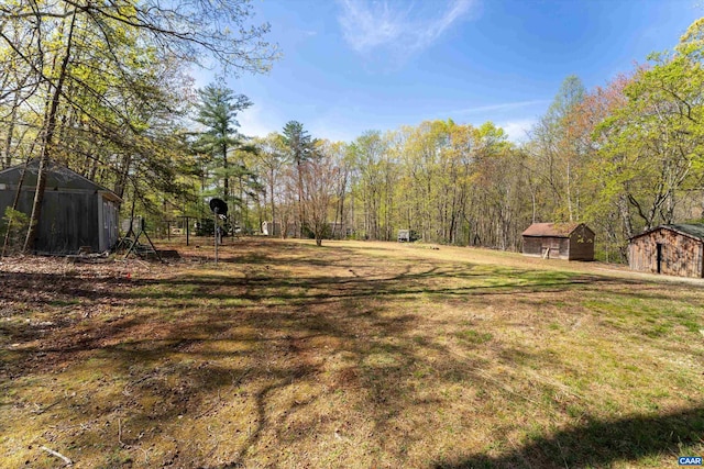 817 Brownings Cv, Shipman, VA 22971 - view of grassy yard featuring a storage shed and an outbuilding