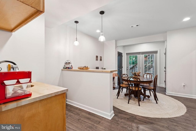 12811 Flintlock Dr, Spotsylvania, VA 22551 - kitchen with dark wood finished floors, baseboards, recessed lighting, and hanging light fixtures