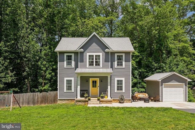 12811 Flintlock Dr, Spotsylvania, VA 22551 - view of front facade with outdoor lounge area, an outdoor structure, a garage, driveway, and a standing seam roof