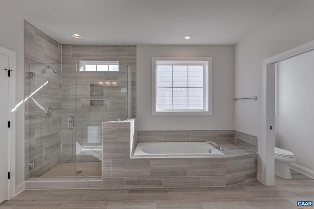 full bath with toilet, a stall shower, a bath, baseboards, and recessed lighting