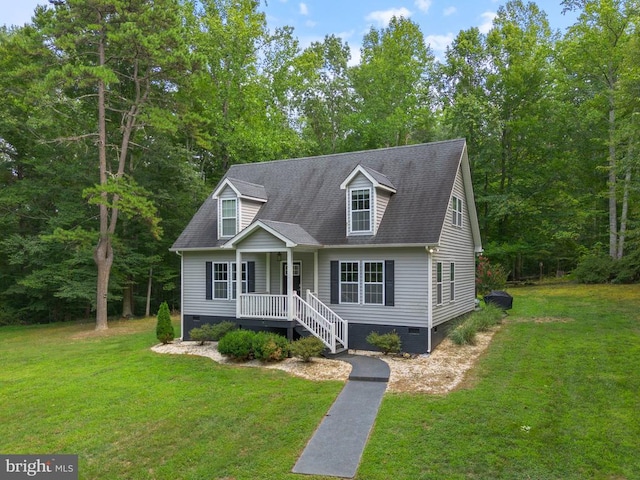 cape cod-style house with crawl space, a shingled roof, and a front lawn