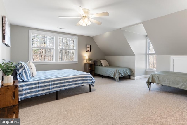 bedroom with baseboards, visible vents, lofted ceiling, ceiling fan, and carpet floors