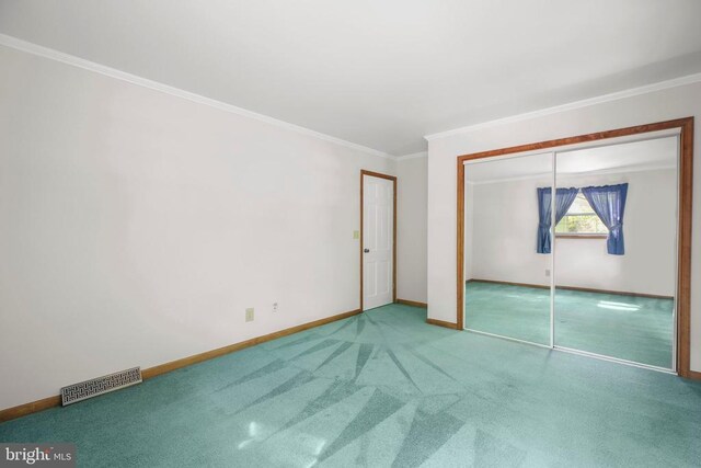 100 Musket Ln, Locust Grove, VA 22508 - unfurnished bedroom with baseboards, ornamental molding, carpet flooring, and a closet
