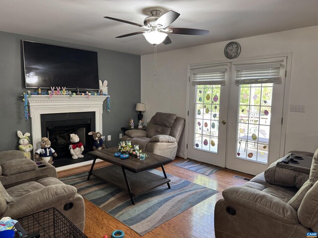 39 Overlook Cir, Palmyra, VA 22963 - living room with ceiling fan, wood finished floors, and a fireplace with raised hearth