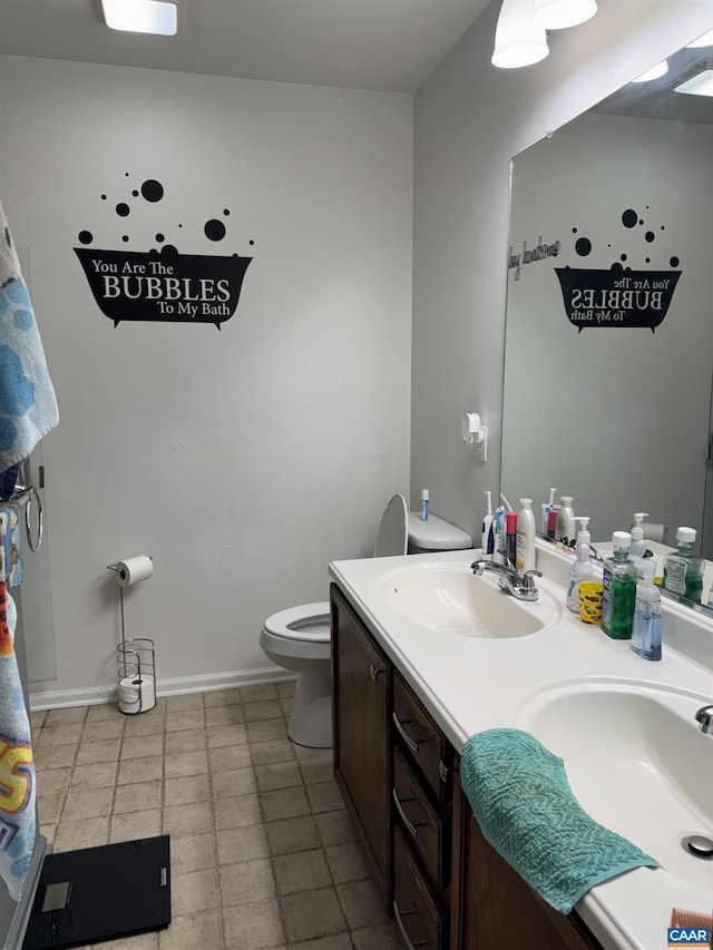 39 Overlook Cir, Palmyra, VA 22963 - bathroom with toilet, double vanity, and baseboards
