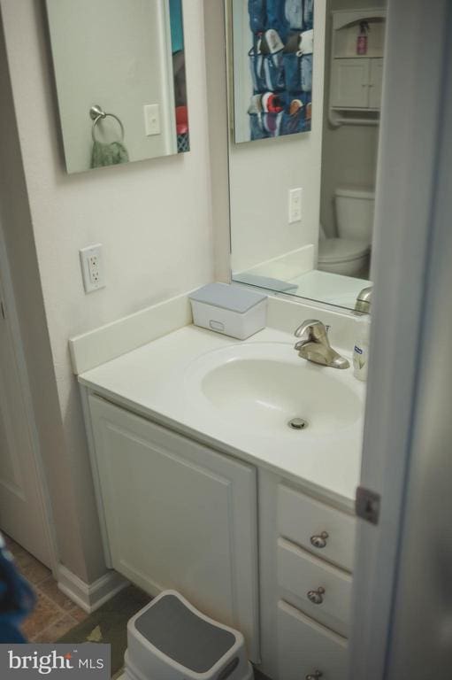 bathroom with vanity and toilet