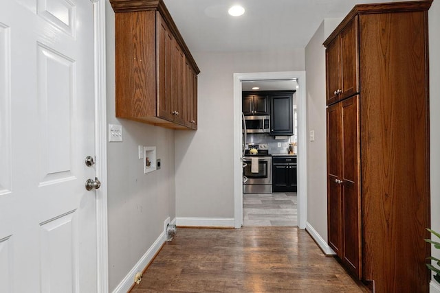 1916 Tinkling Spring Rd, Stuarts Draft, VA 24477 - washroom with wood finished floors, washer hookup, baseboards, cabinet space, and recessed lighting