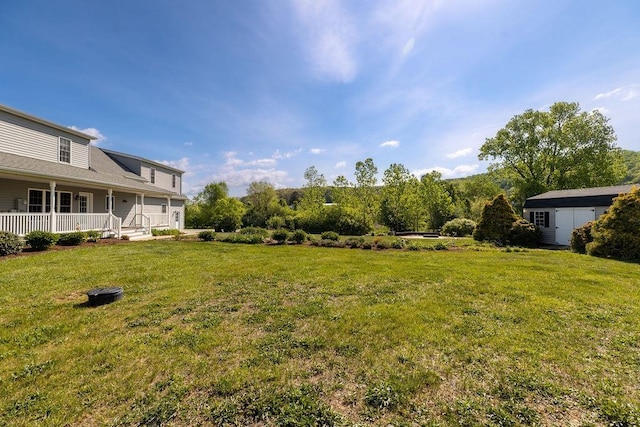 1916 Tinkling Spring Rd, Stuarts Draft, VA 24477 - view of grassy yard featuring covered porch, an outbuilding, and a storage shed