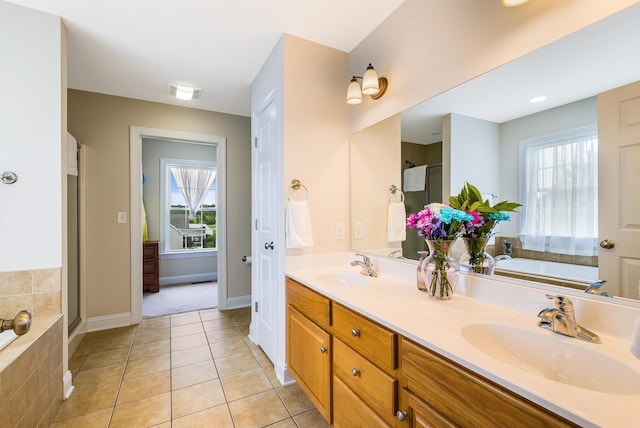902 Waterton St, Staunton, VA 24401 - full bath with double vanity, a bath, healthy amount of natural light, and tile patterned floors