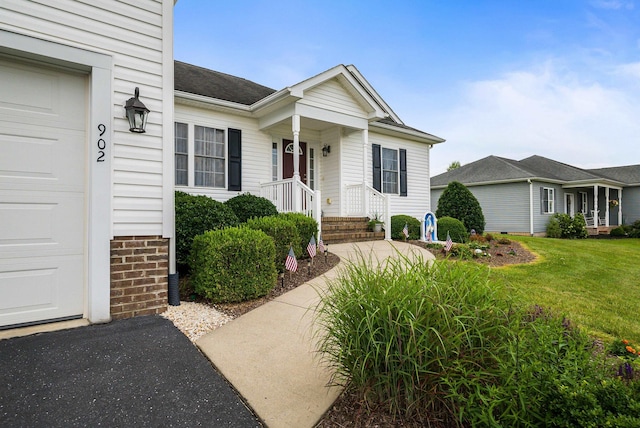 902 Waterton St, Staunton, VA 24401 - view of exterior entry with a yard and a shingled roof