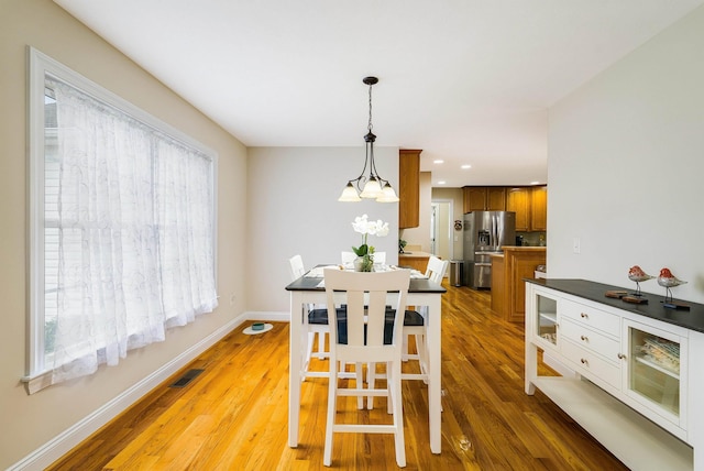 902 Waterton St, Staunton, VA 24401 - dining space with light wood finished floors, recessed lighting, and a chandelier