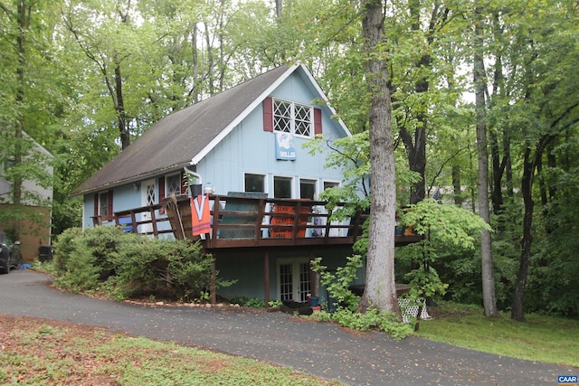 1 Stonewall Rd, Palmyra, VA 22963 - rustic home featuring french doors, a deck, and board and batten siding