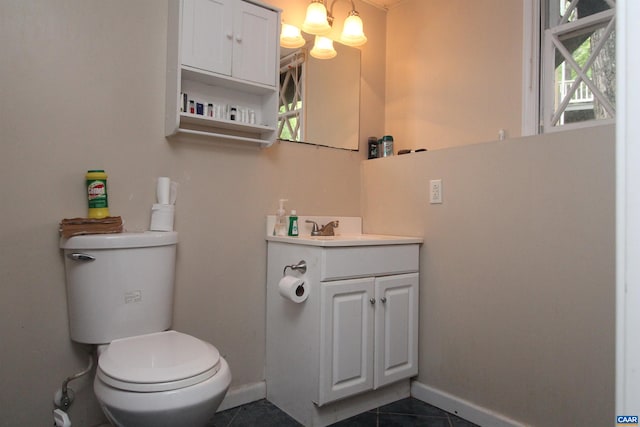 1 Stonewall Rd, Palmyra, VA 22963 - half bathroom featuring tile patterned floors, toilet, baseboards, and vanity