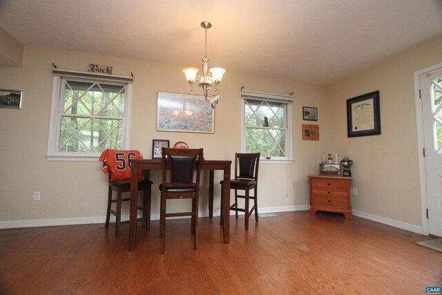 1 Stonewall Rd, Palmyra, VA 22963 - dining area featuring a chandelier, wood finished floors, and baseboards