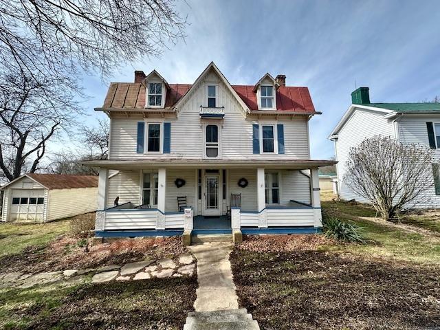 8892 Highland Tpke, Tpke, VA 24458 - victorian house with a chimney, an outbuilding, covered porch, and a garage