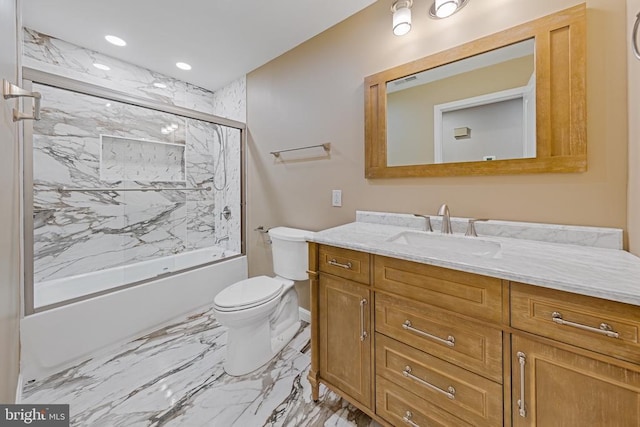 bathroom featuring marble finish floor, recessed lighting, toilet, enclosed tub / shower combo, and vanity