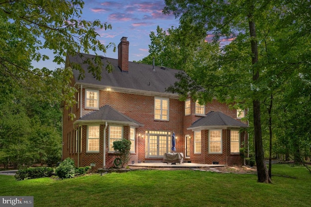13904 Hunting Run Dr, Fredericksburg, VA 22407 - rear view of house featuring a lawn, a patio area, and brick siding