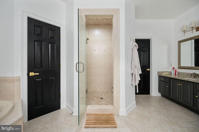 13904 Hunting Run Dr, Fredericksburg, VA 22407 - full bath with a shower stall, tile patterned floors, vanity, baseboards, and a garden tub
