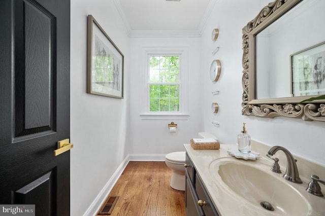 13904 Hunting Run Dr, Fredericksburg, VA 22407 - bathroom with toilet, wood finished floors, baseboards, crown molding, and vanity