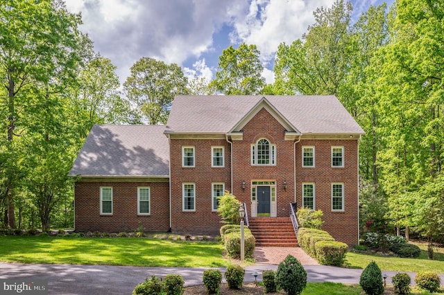 13904 Hunting Run Dr, Fredericksburg, VA 22407 - view of front facade featuring brick siding and a front lawn