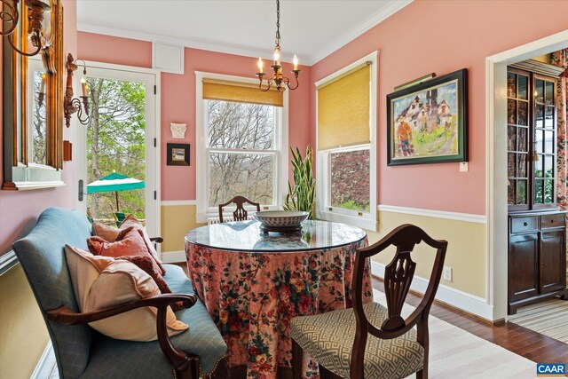 356 Routier Hill Rd, Hot Springs, VA 24445 - dining space featuring a chandelier, wood finished floors, baseboards, and ornamental molding