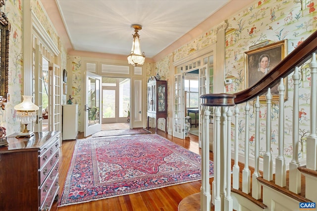 356 Routier Hill Rd, Hot Springs, VA 24445 - entrance foyer with wood finished floors, wallpapered walls, and a chandelier