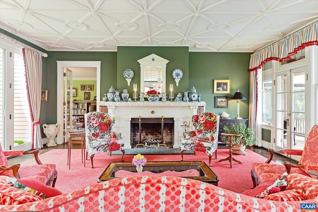 356 Routier Hill Rd, Hot Springs, VA 24445 - living room with healthy amount of natural light, a fireplace, an ornate ceiling, and wood finished floors
