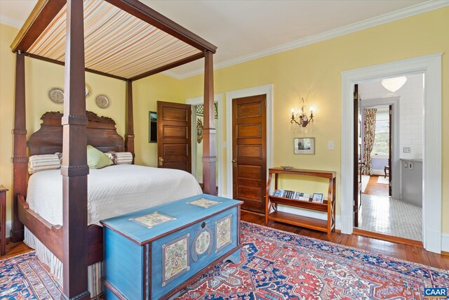 356 Routier Hill Rd, Hot Springs, VA 24445 - bedroom featuring wood finished floors, crown molding, and baseboards