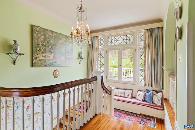 356 Routier Hill Rd, Hot Springs, VA 24445 - hallway featuring wood finished floors, a chandelier, and an upstairs landing