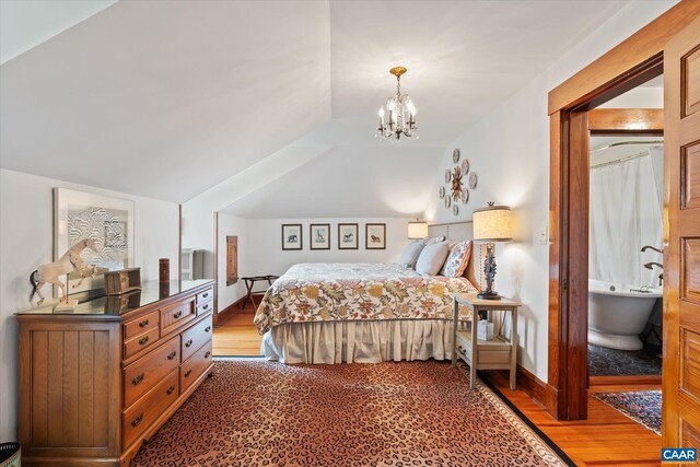 356 Routier Hill Rd, Hot Springs, VA 24445 - bedroom featuring wood finished floors, lofted ceiling, a chandelier, and baseboards