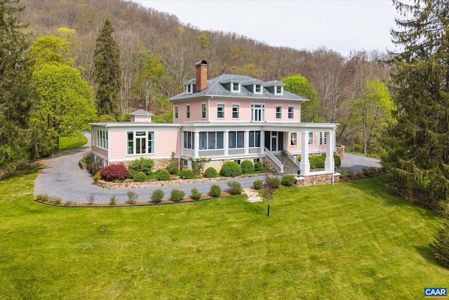 356 Routier Hill Rd, Hot Springs, VA 24445 - rear view of house with a forest view, a lawn, a chimney, stairs, and a porch