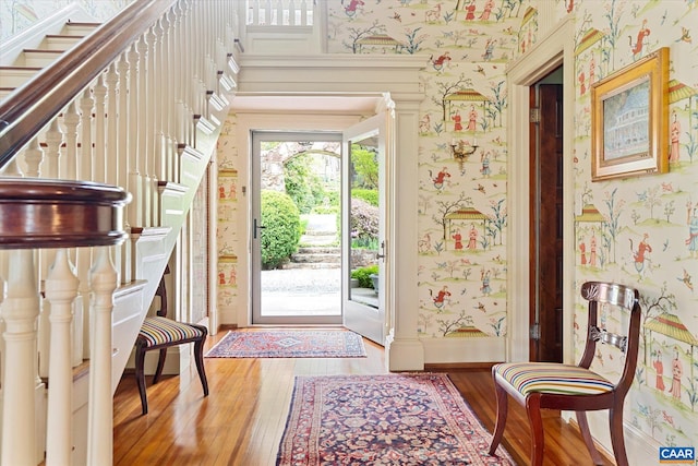 356 Routier Hill Rd, Hot Springs, VA 24445 - foyer with wallpapered walls, wood-type flooring, stairway, and baseboards