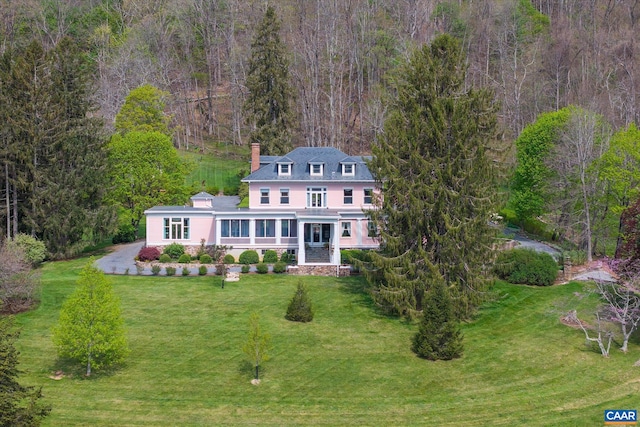 356 Routier Hill Rd, Hot Springs, VA 24445 - back of house with a chimney, a lawn, and a wooded view