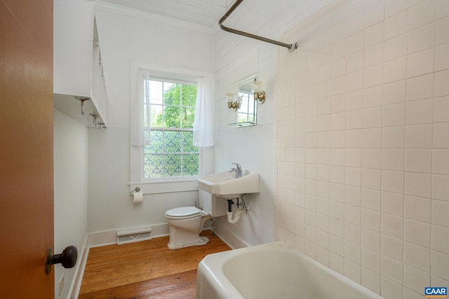 1704 Rugby Cir, Charlottesville, VA 22903 - full bathroom with toilet, wood finished floors, a sink, ornamental molding, and shower / bath combination