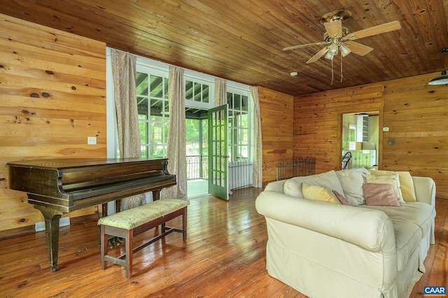 1704 Rugby Cir, Charlottesville, VA 22903 - sitting room with healthy amount of natural light, a ceiling fan, wooden walls, wood ceiling, and wood-type flooring