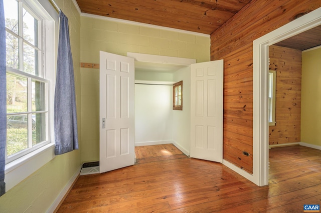 1704 Rugby Cir, Charlottesville, VA 22903 - unfurnished bedroom with hardwood / wood-style flooring, wooden ceiling, wooden walls, and baseboards