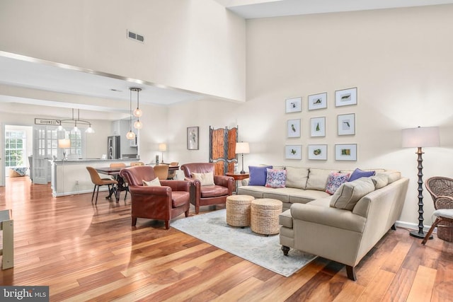 9204 Saint Andrews Ln, Fredericksburg, VA 22408 - living area featuring light wood-style floors and a high ceiling