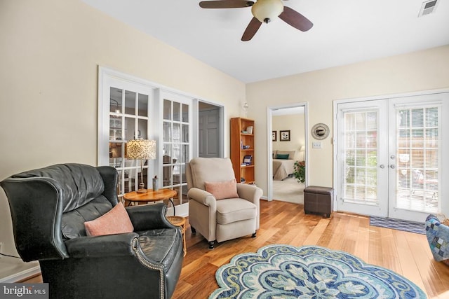 9204 Saint Andrews Ln, Fredericksburg, VA 22408 - living area with french doors, light wood-style flooring, and a ceiling fan