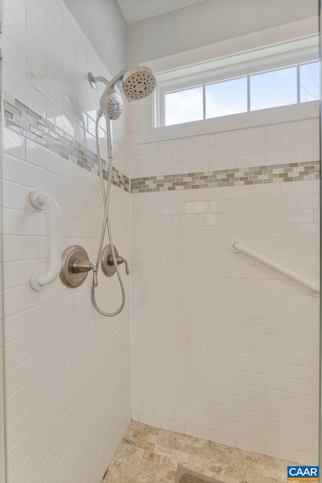 full bathroom with a tile shower