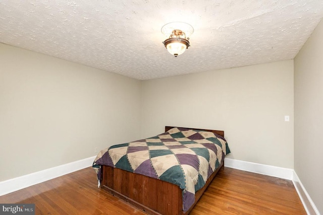 199 Peliso Ave, Orange, VA 22960 - bedroom featuring wood finished floors, baseboards, and a textured ceiling