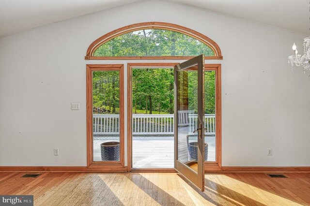 7312 Sugar Hollow Rd, Orange, VA 22960 - doorway to outside featuring wood-type flooring, a chandelier, vaulted ceiling, baseboards, and french doors