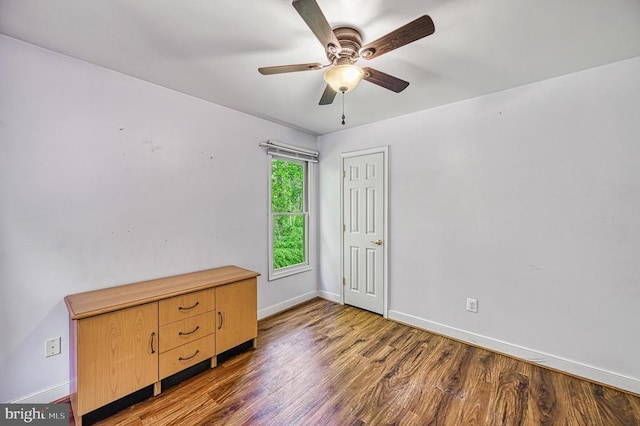 7312 Sugar Hollow Rd, Orange, VA 22960 - unfurnished bedroom featuring baseboards, wood finished floors, and a ceiling fan
