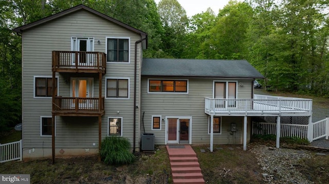 7312 Sugar Hollow Rd, Orange, VA 22960 - rear view of house with a balcony, central AC, fence, and view of scattered trees