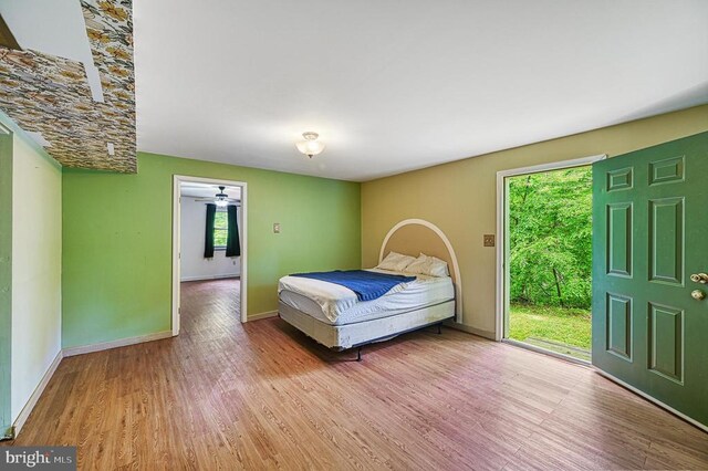 7312 Sugar Hollow Rd, Orange, VA 22960 - bedroom with multiple windows, wood finished floors, and baseboards