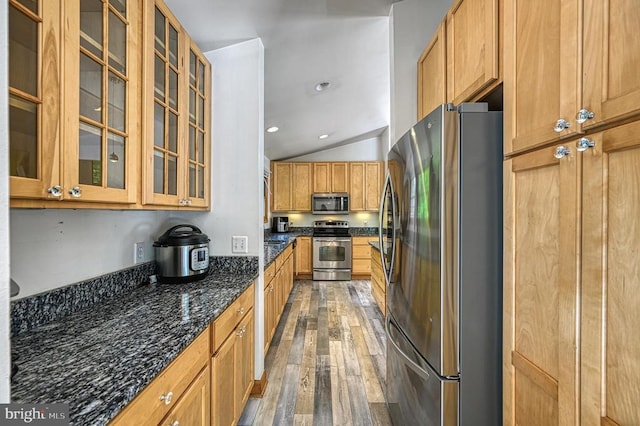 7312 Sugar Hollow Rd, Orange, VA 22960 - kitchen featuring stainless steel appliances, light wood-type flooring, dark stone countertops, lofted ceiling, and glass insert cabinets