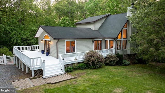 7312 Sugar Hollow Rd, Orange, VA 22960 - back of house featuring a chimney, a yard, a wooden deck, and roof with shingles