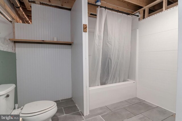  - full bath featuring tile patterned floors and shower / tub combo