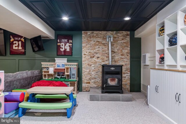  - bedroom with a wood stove, carpet, and recessed lighting